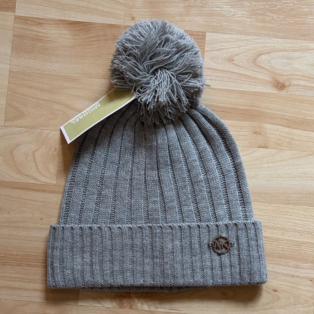 Gray ribbed Michael Kors beanie with polished metal embellishment
